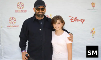 Two people posing at event