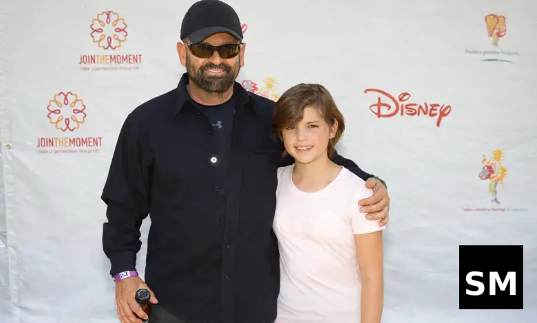 Two people posing at event