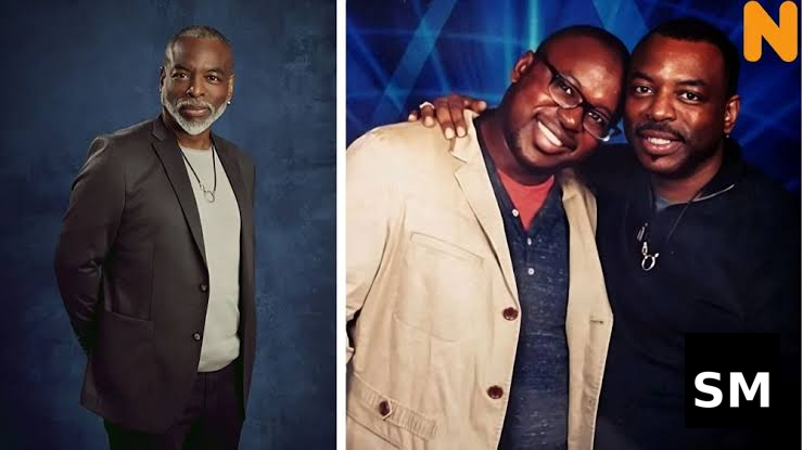 Two men posing for photos.