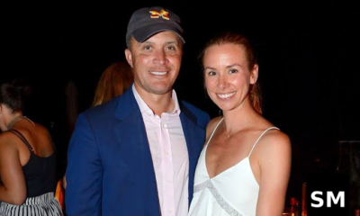 Couple posing at evening event.