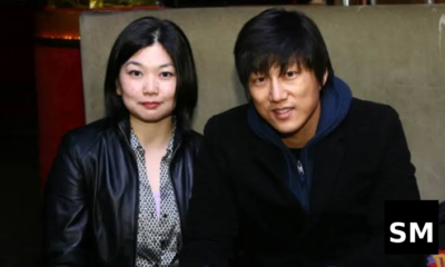 Two people sitting together indoors.